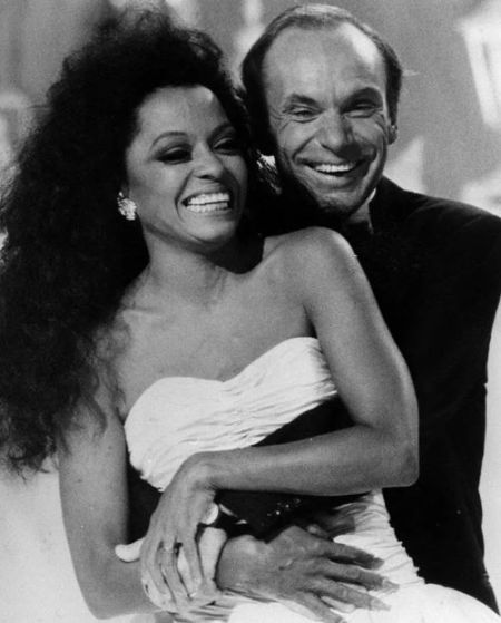 Arne Naess Jr. and Diana Ross hugging each other